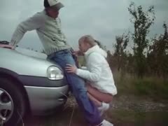 Amateur blond in white jacket got nailed on the car hood by my fellow